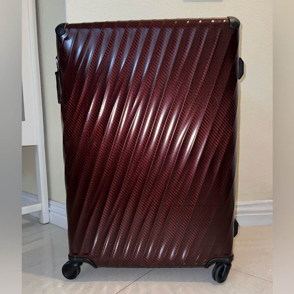 Stylish Burgundy Tumi Suitcase with Wheels